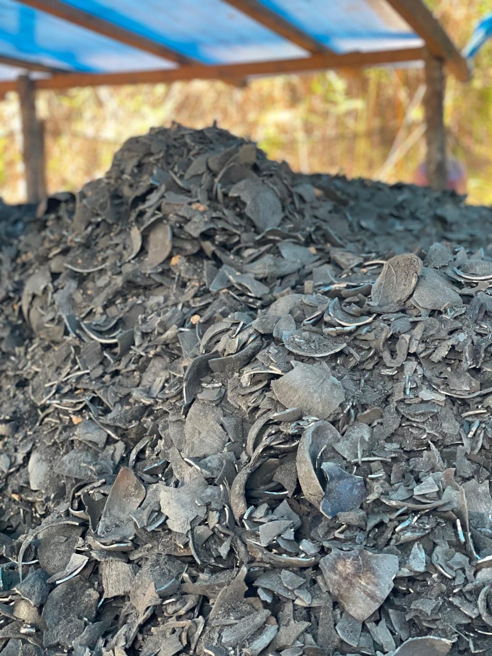 Coconut shell charcoal pile ready for production handling