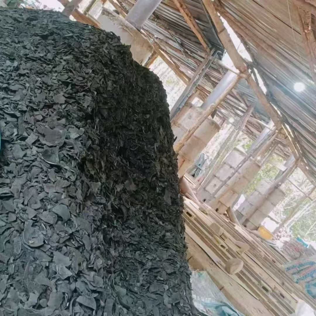 Warehouse stockpile of coconut shell charcoal at manufacturing facility